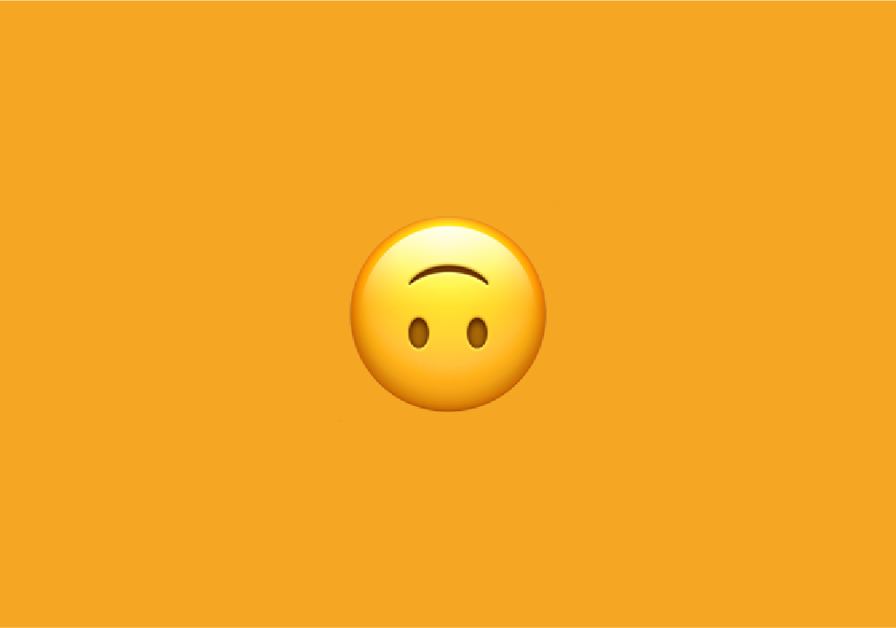 What does the upside-down face emoji mean?