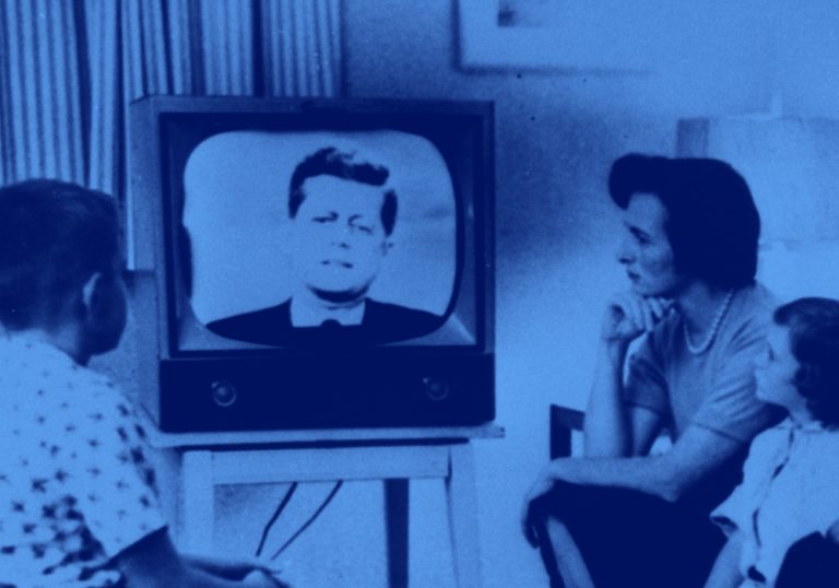 image of family watching JFK on the television