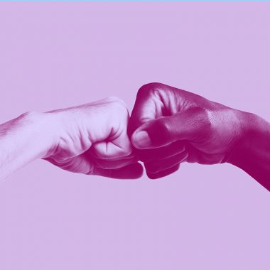 two hands fist-bumping