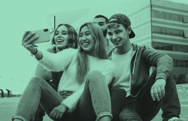 Group of teens taking a selfie, teal filter