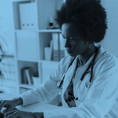 scientist in a lab, blue filter.