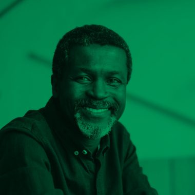 close up of man smiling, green filter