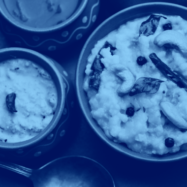 photo of bowl of pongal (milk rice dish), blue filter.