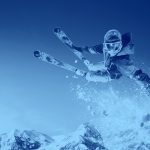 Skier jumping over snow, blue filter.