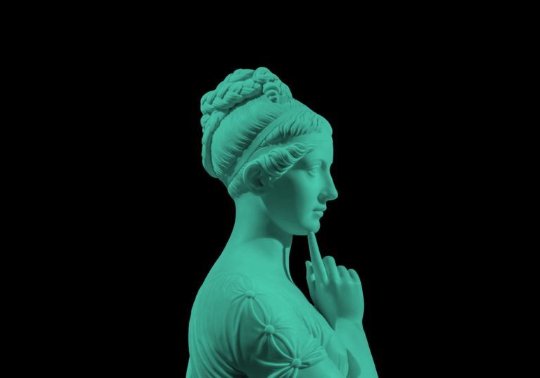 Side view of plaster sculpture of woman from ancient Greece.