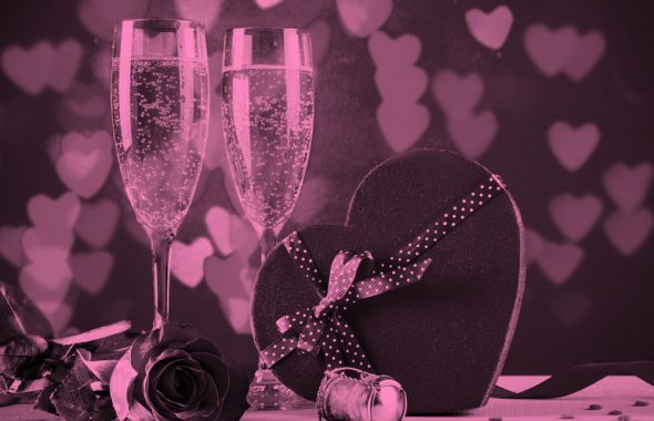 2 champagne glasses and a heart-shaped box of chocolates, pink filter