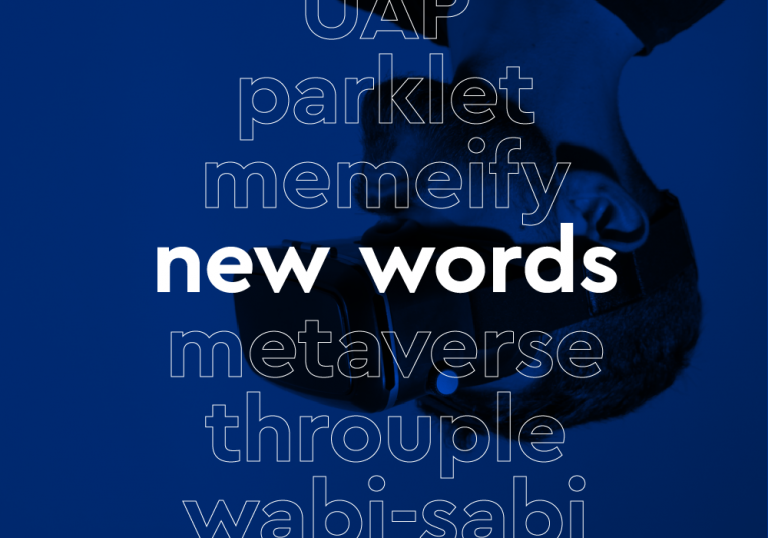 A dark blue background with an upside-down image of a man wearing virtual reality goggles. Imposed on the background is a list of words in white outline: UAP, parklet, memeify, new words [in bold white letters], metaverse, throuple, wabi-sabi