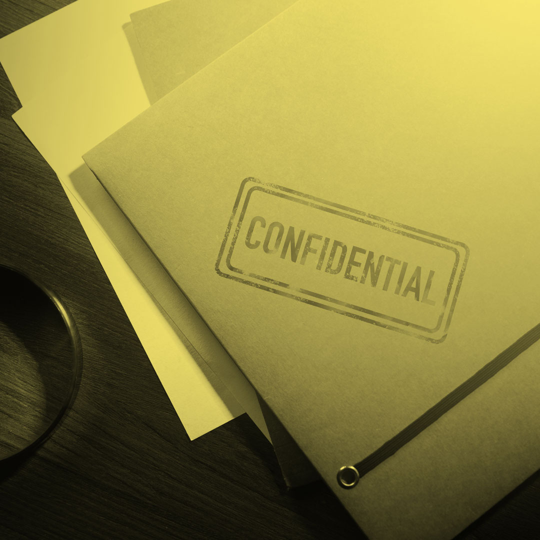 file folders marked with a confidential stamp