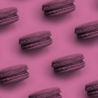 macaron cookies on a pink background