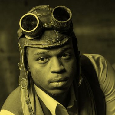 filtered image of a Black man dressed in steampunk outfit