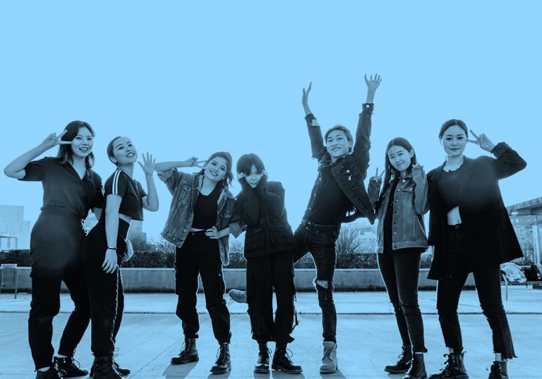 blue filtered image of girl k-pop band posing for the camera.