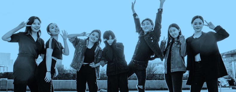 blue filtered image of girl k-pop band posing for the camera.