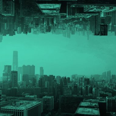 image of a cityscape reflected upon itself, in teal filter.