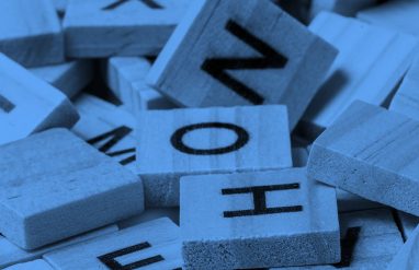 assorted scrabble tiles, in blue filter.