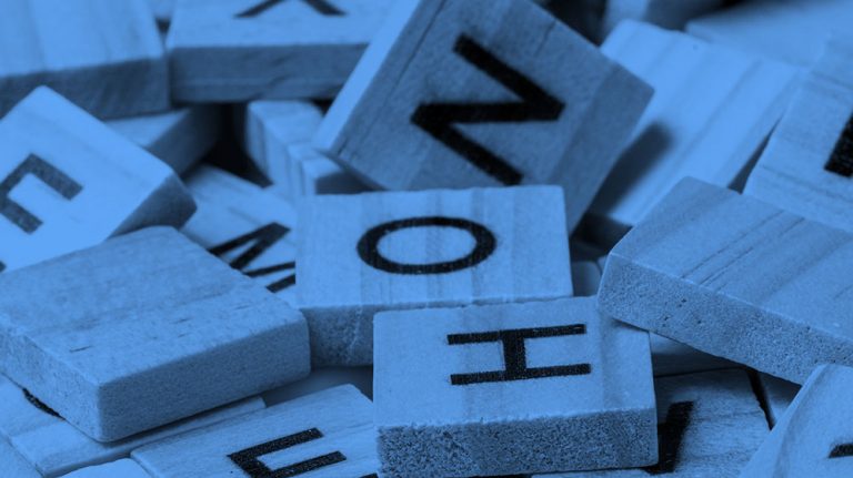 assorted scrabble tiles, in blue filter.