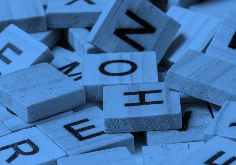assorted scrabble tiles, in blue filter.