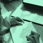 woman doing math calculations in a notebook, teal filter.