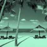 beach view with palm trees and cabanas in teal filter.