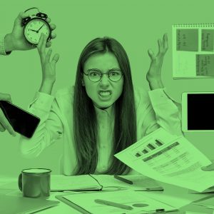 woman overwhelmed at desk