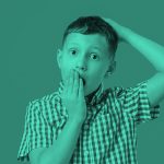 boy with hand over mouth