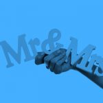 hand holding Mr & Mrs sign