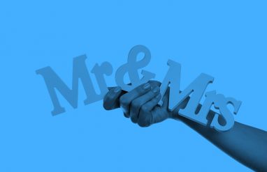 hand holding Mr & Mrs sign