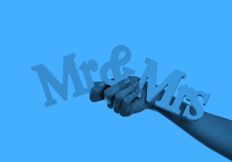 hand holding Mr & Mrs sign