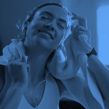 woman with towel at gym, blue filter