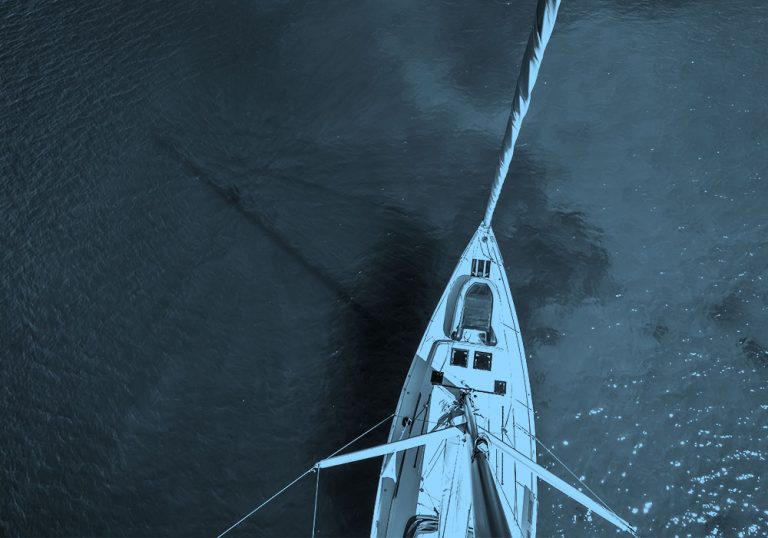 top down image of boat, blue filter