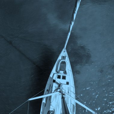 top down image of boat, blue filter