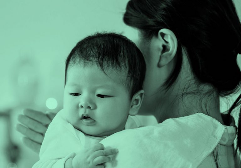 mom burping baby, green filter