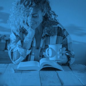 woman reading book, farm house, blue filter