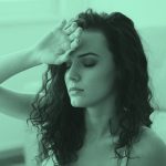 woman fainting, lightheaded, blue green filter