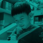 boy reading book, green filter