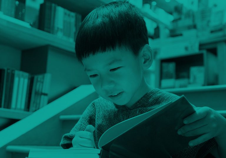 boy reading book, green filter