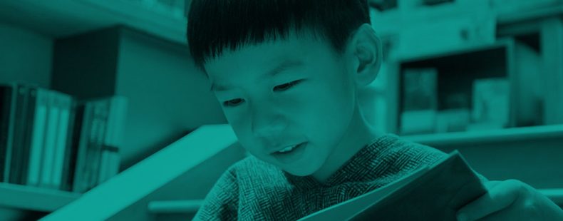 boy reading book, green filter