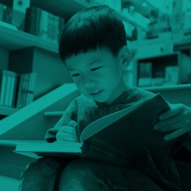 boy reading book, green filter