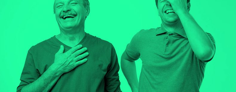 older and younger men laughing; green filter