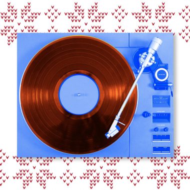 vinyl player, blue, on holiday sweater print background