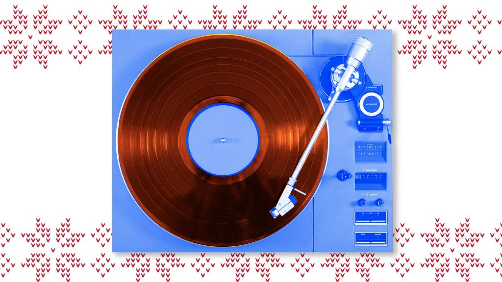vinyl player, blue, on holiday sweater print background